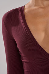 DEEP V LONG SLEEVE JUMPSUIT IN RAISIN